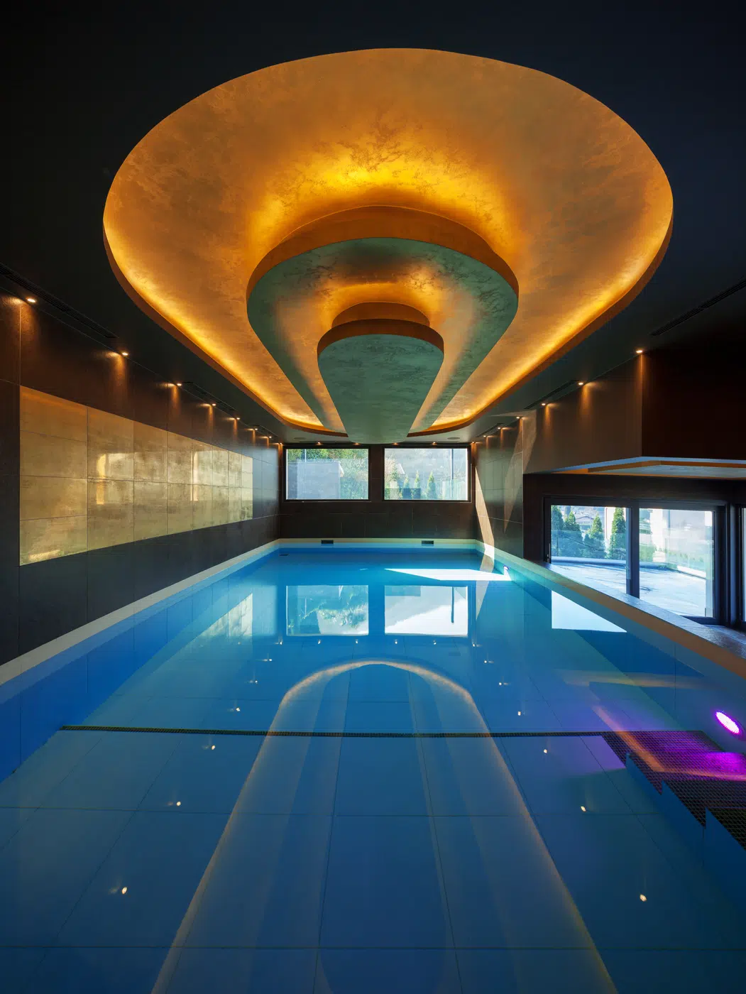 Luxury indoor ship and hospitality pool deck with ambient lighting