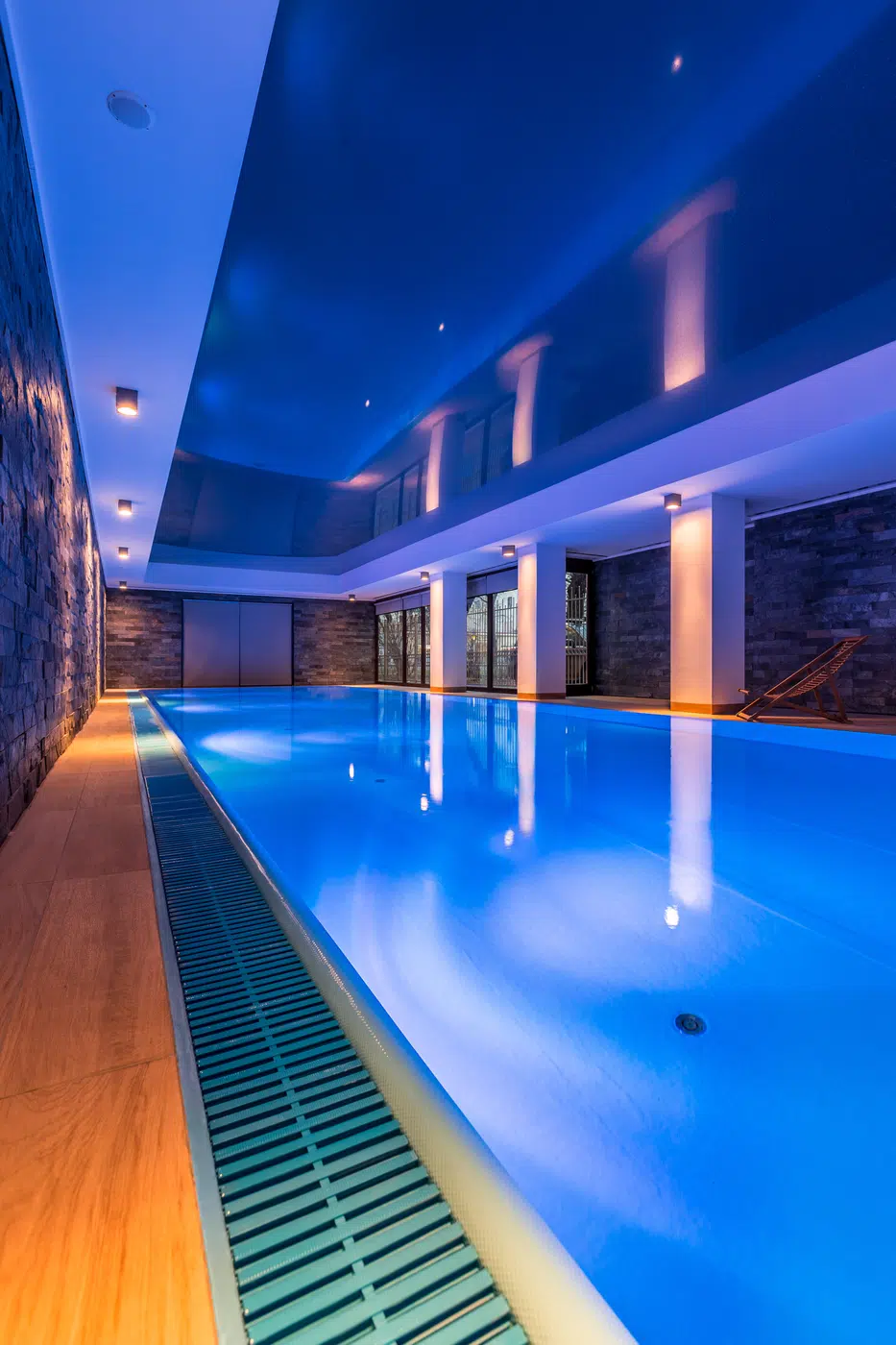 Illuminated luxury hotel indoor swimming pool