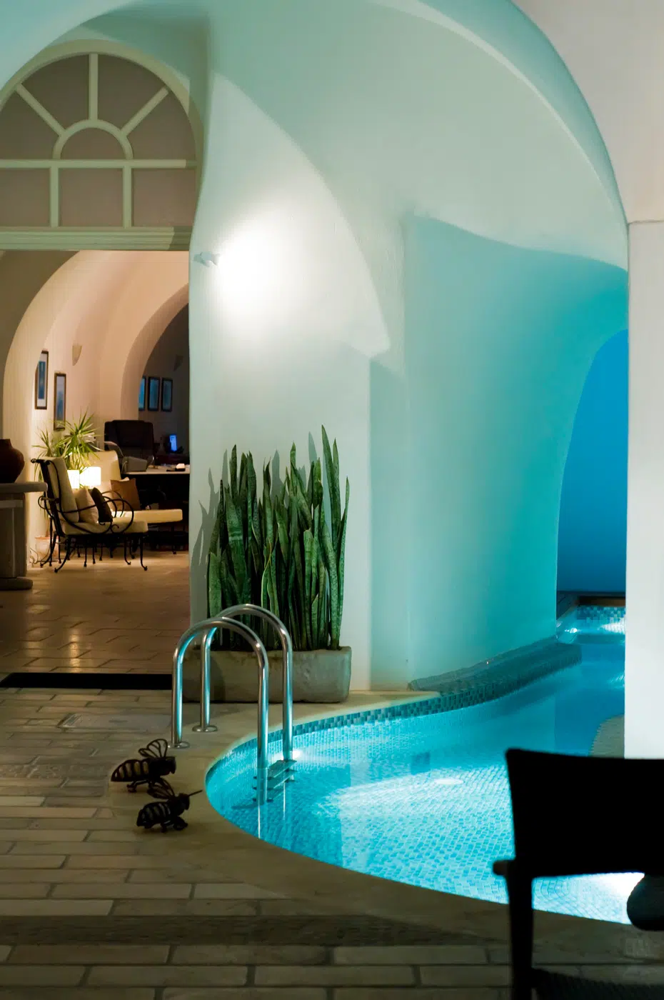 Serene indoor spa pool sanctuary with curved architectural walls
