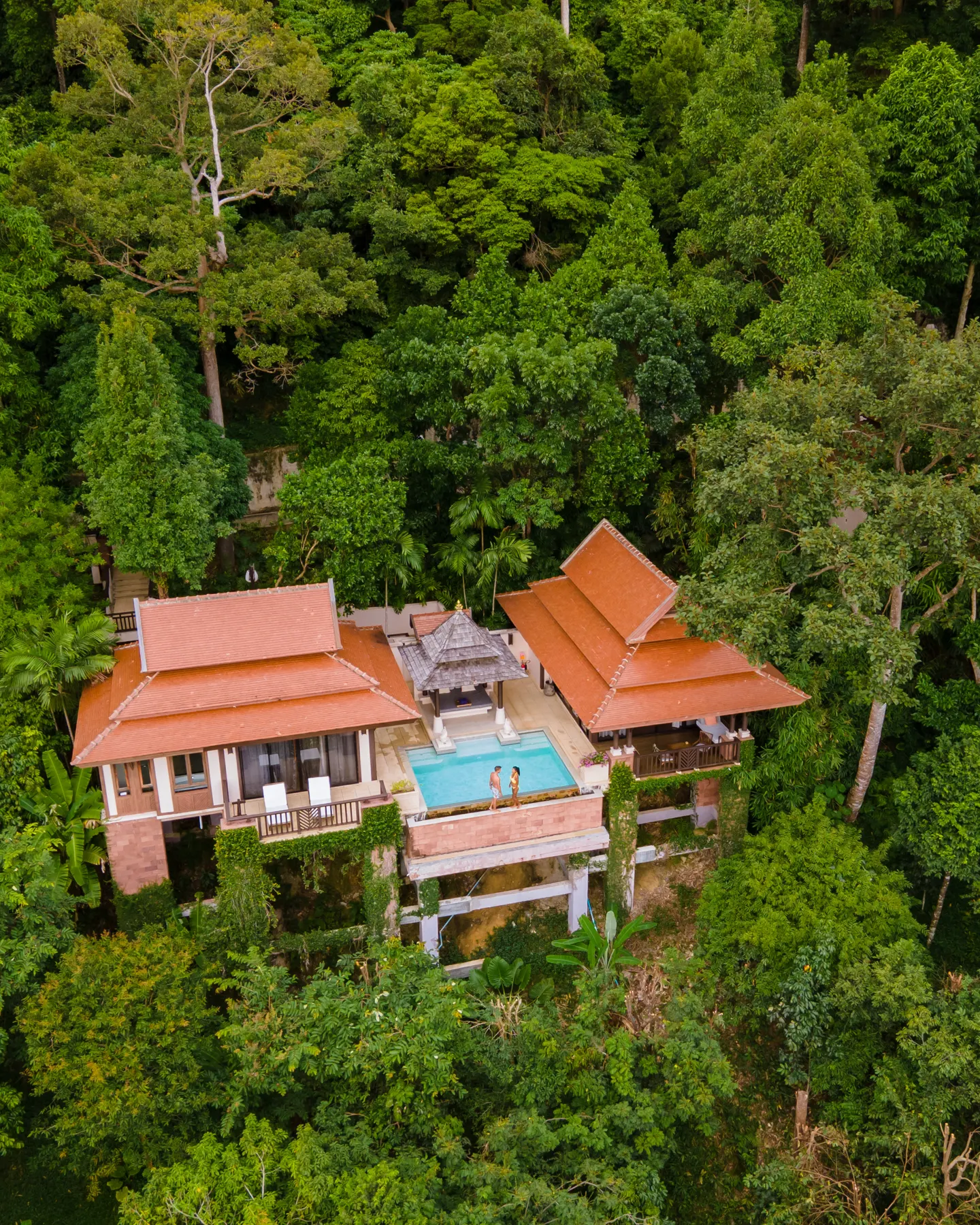 Aerial view of luxury architectural estate with courtyard swimming pool