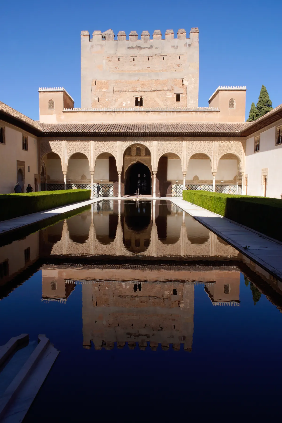 Architectural luxury retreat courtyard pool with arched colonnade