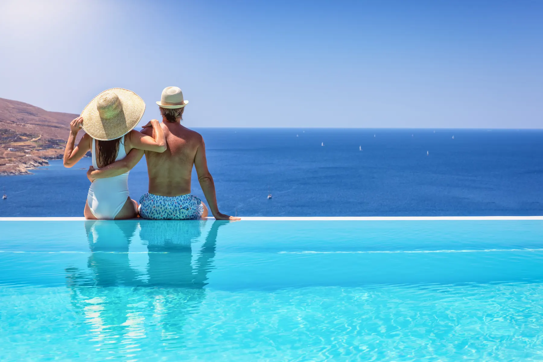 Bathers relaxing in clear outdoor recovery pool